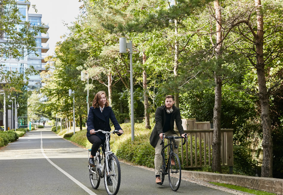 Two people cycling on The Seamark Building bike lanes in Dublin